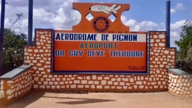 The Pignon airfield entrance sign, named in tribute to Dr. Guy Deve Théodore.