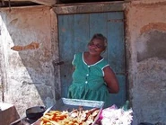 Local-lady-offering-cooked-goods-for-sale-0.jpg (15 KB) Local lady offering goods for sale