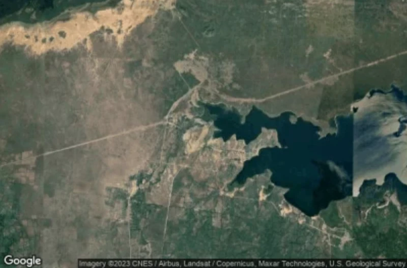 Aerial view of the Phaéton area, showing the flat coastal plain where the disused airstrip is located.