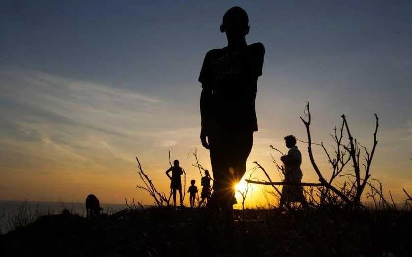 A boy stands on top of the hillside of town of Jeremie, Haiti, which is located in the same Grand’ Anse region as the town of .