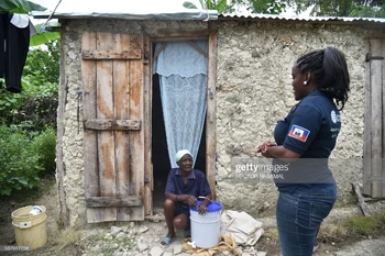 A member of ACTED (Agency for Technical Cooperation and Development) gives healthcare intructions in the commune of La Chapelle, Haiti