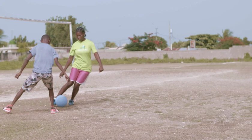 Two youths playing soccer; Cabaret, , 