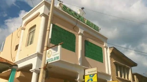 Exterior of the Socolavim building in Saint-Marc, a multi-story commercial property serving local banking and transfer needs.