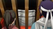 Saitou is telling Chizuru about swords