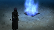 A Rasetsu turns into ash and lights up with blue flame