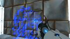 Blue portal bouncing off a metal wall.