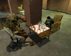 Vortigaunt playing chess with a female Citizen in a common room.