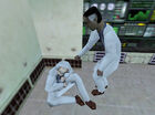 Eli helping a scientist after the Resonance Cascade.