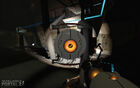 Hover Turret carried by Chell in an early Portal 2 screenshot.