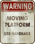 "Moving Platform / Use handrails" warning sign.