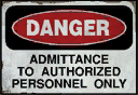 Common danger sign seen on a door on the condemnation wall, seen in other Valve games: Danger / Admittance to authorized personnel only.