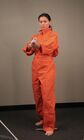 Reference shot of Alésia Glidewell as Chell taken in August 2006, with orange jumpsuit and ASHPD placeholder, sent by e-mail to a fan by Valve's Bill Van Buren.