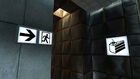 Signs indicating that after Test Chamber 19 comes the exit and cake.