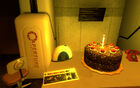 The cake, a radio and the Aperture Science Red Phone on the desk of the lobby of GLaDOS' Chamber after the end of Portal.