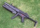 Hk mp5a5.jpg (40 КБ) То же, но с выдвинутым прикладом и без глушителя.