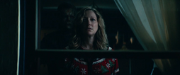 Michael appears behind Karen