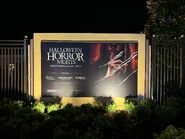Halloween Horror Nights 33 Poster outside the park Image from HorrorUnearthed