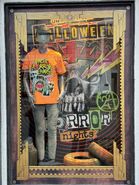 Halloween Horror Nights 2024 "Where Horror Lives" Merchandise Window Display Image from HorrorUnearthed