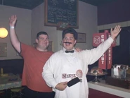 Sam and guest in the deli