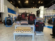 Halloween Horror Nights 2022 Never Go Alone Limited Edition T-Shirt & Ornament Merchandise Preview Image from HorrorUnearthed