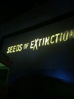 Projection of the Seeds of Extinction logo.