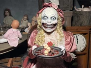Smiling Clown Doll with Death By Chocolate desert Image from Universal Horror Unleashed Las Vegas