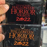541E15D6-DE8F-48E0-84EA-A9E4EDA7F781.jpeg (843 KB) Halloween Horror Nights 2022 Red and Orange Laynard Pouches Image from HorrorUnearthed