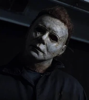 Courtney as Michael Myers, wearing his mask