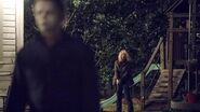 Laurie Strode standing behind Michael to attack him in Halloween (2018)