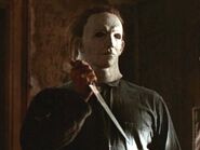 Mike Myers holding knife