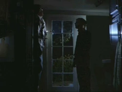 This scene features Michael (right), who pins Bob (left) to the door and observes his dying motions. Remaining relatively un-graphic, this scene displays the use of lighting to create its atmosphere rather than graphic blood and violence.