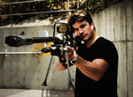 Fillion posing with the rifle.