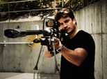 Nathan Fillion, a Halo 3, Halo 3: ODST and Halo: Reach voice actor, wields a real-world replica of the SRS99D.