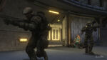 A soldier and Noble Six secure a room.