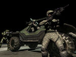 Two Marines by a Warthog along with Master Chief.