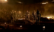 McKay pays her final respects to Captain Delgado on Arcadia.