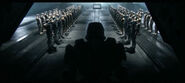 Спартанцы-IV и морские пехотинцы приветствуют Джона-117 в ангаре "Бесконечности" после его возвращения на Землю.