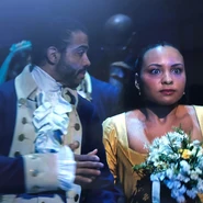 Lafayette whispering to surprised Peggy