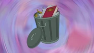 A trash bin, with the rule book inside (used to transition back to Gretel being held by the fifty copies of Mary)