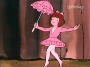 Darla wearing a ballet tutu and holding a parasol in "Big Top Rascals"