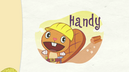 Handy is smiling while in an orange background with a few logs.