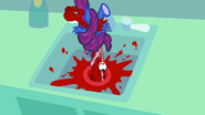 Petunia's body completely mangled up after the Demon pulls her through the drain.