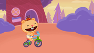 Cub is able to ride his trike without touching the pedals.