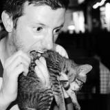 Jim pretending to eat a cat.