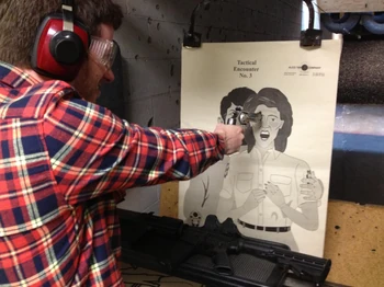 Jim fooling around at a shooting range.