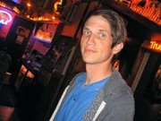 Jason in an arcade, which is used for his badge.