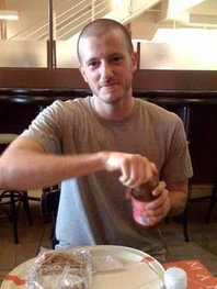 Jim opening a bottle of tea.