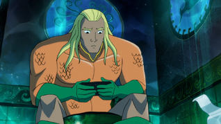 Aquaman watching the Tawny Young Show whilst sitting on the toilet.
