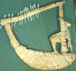 http://sumerianshakespeare.com/117701/117901.html (77 KB) 2600 - 2000 BCE - Boat Lyre, with a standing stag figurine. (Modern-day Iraq)