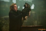 Peter Pettigrew holding Voldemort's rudimentary body